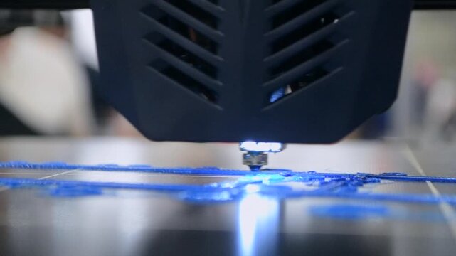 Process printing on 3D printer. The 3D printing process from molten plastic blue color. 3D printing technology. FDM technologies. Fused Deposition Modeling. Additive manufacturing.