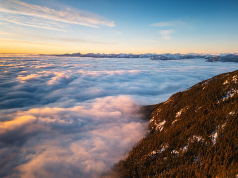 Breathtaking sea of clouds and mountain inversion at sunset in British Columbia Canada