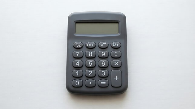 Black handheld calculator on a white surface.