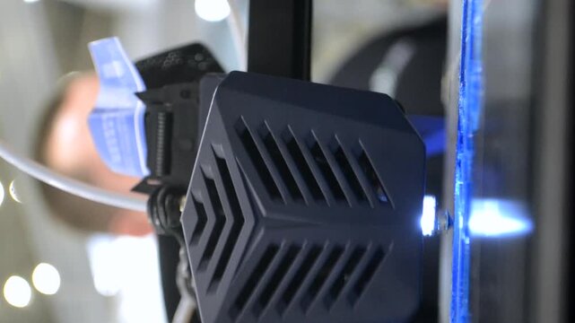 Process printing on 3D printer. The 3D printing process from molten plastic blue color. 3D printing technology. FDM technologies. Fused Deposition Modeling. Additive manufacturing. Vertical