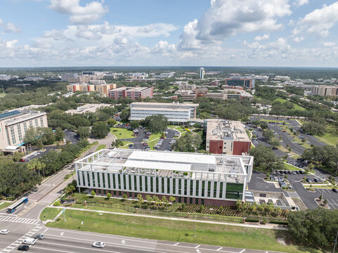 Tampa, United States - 10 July 2025: Aerial view of the University of South Florida campus with modern buildings, green landscaping, and urban infrastructure in Tampa, Florida.