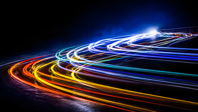 Captivating long exposure photograph of vibrant car light trails in an urban setting, symbolizing speed and modern city life, glowing traffic, dynamic motion and illuminated streets