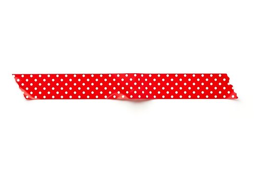 A red polka dot ribbon on a white background