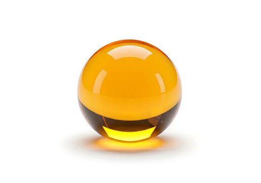 A yellow and black glass ball on a white background