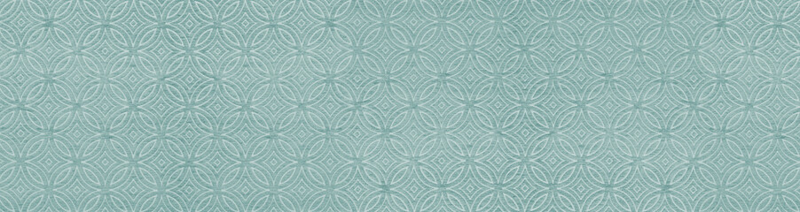 Fototapeta premium Close up view of a seamless teal blue woven fabric texture with an overlapping circle geometric pattern for interior design backgrounds.