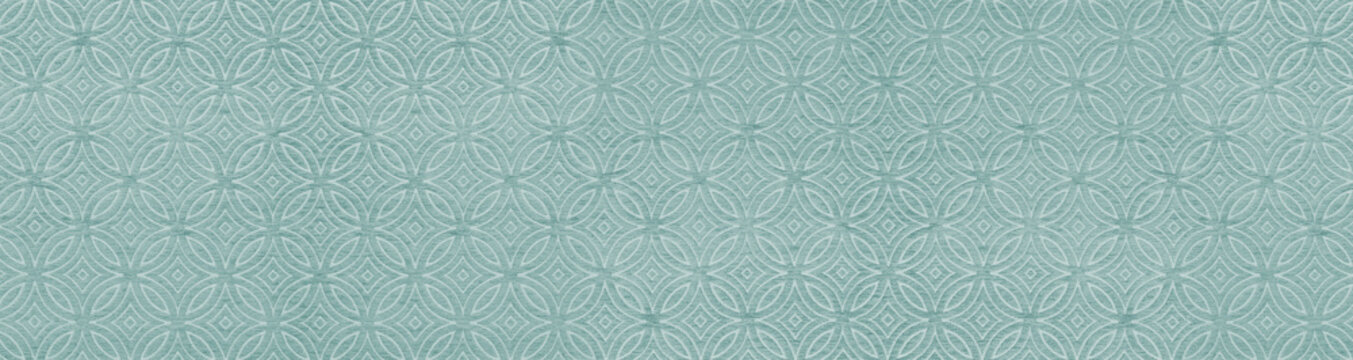 Close up view of a seamless teal blue woven fabric texture with an overlapping circle geometric pattern for interior design backgrounds.