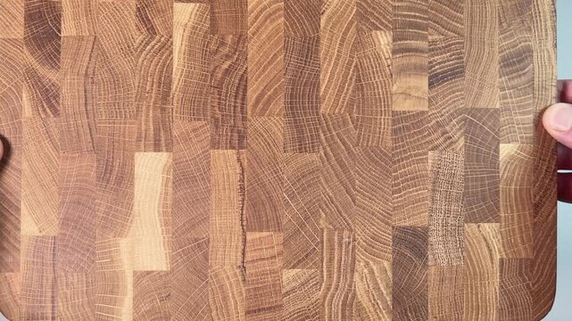 Demonstration of oak end grain cutting board surface in hands