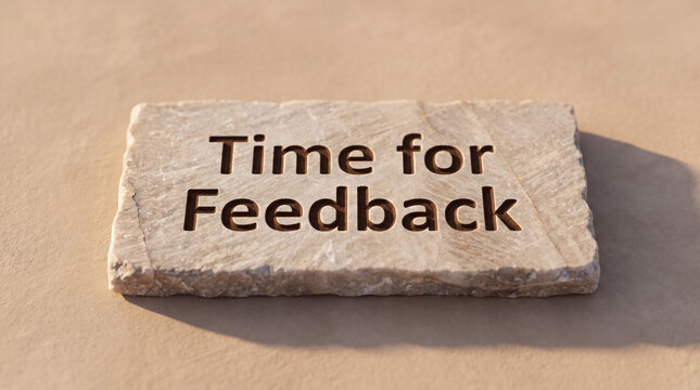 Stone slab showing carved text time for feedback, representing a request for evaluation, review, and comment