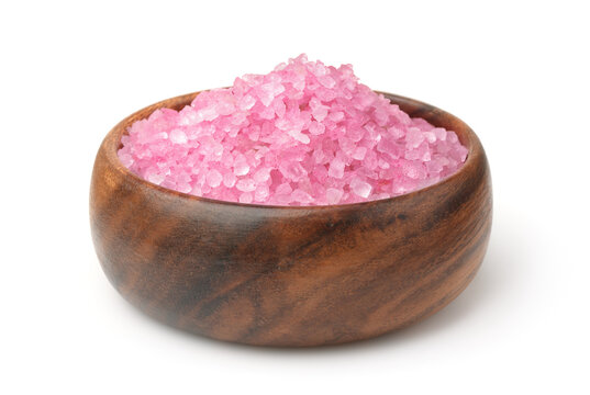 Pink aromatic bath salt in wooden bowl