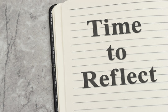 Time to reflect text on writing journal on marble stone for journaling for self-care