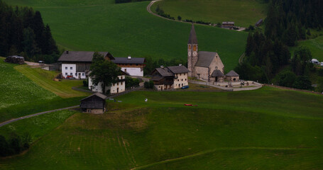Obraz premium Landscape village Santa Maddalena in mountain valley at sunset in Dolomites, Italy. St. Magdalena and mountains. Val di Funes 