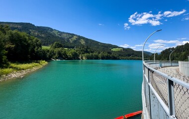 Obraz premium Peaceful Lake With Mountain, Tranquil Alpine Landscape With Shimmering Waters And Slopes