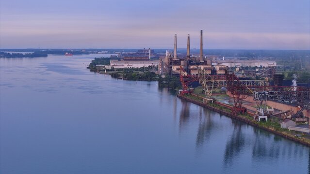 River Rouge, Michigan, United States - 09 August 2026: Aerial view of the DTE Energy River Rouge Power Plant along the Detroit River, with industrial smokestacks and cranes.