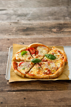 Homemade pizza with tomatoes and mozzarella cheese