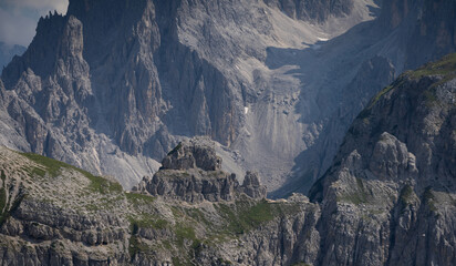 Obraz premium Mountain landscape panorama Tre Cime Mount against a blue summer background. 