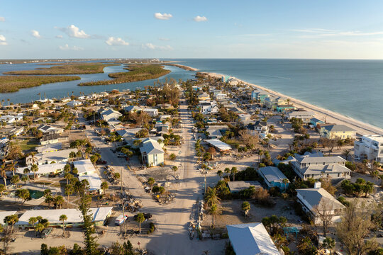 Storm surge caused by hurricane wind severe damaged residential houses on ocean shore. Natural disaster consequences in Florida