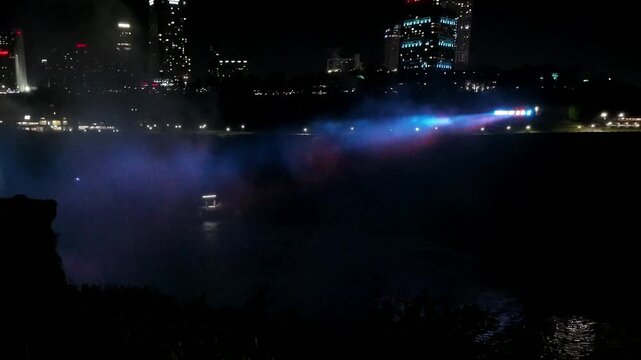 Niagara Falls at Dusk with Illuminated Mist and Skylon Tower Skyline in Ontario, Canada