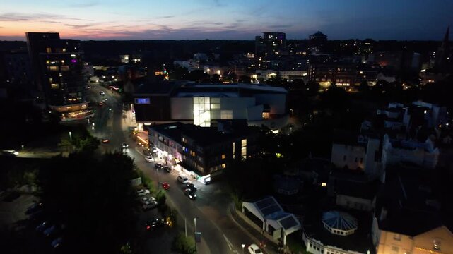 High Angle Night Footage of Illuminated Buildings and Roads with Traffic at Best Tourist Attraction Destination of England at Bournemouth City with Sandy Beach and Ocean of Great Britain, 