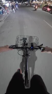 First Person View Cycling on City Street at Night