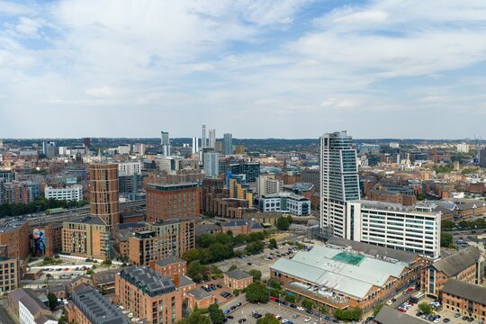 Aerial photo across Leeds city centre showing Bridgewater Place and a dense urban landscape of modern high rise towers residential developments offices railway lines and traditional architecture