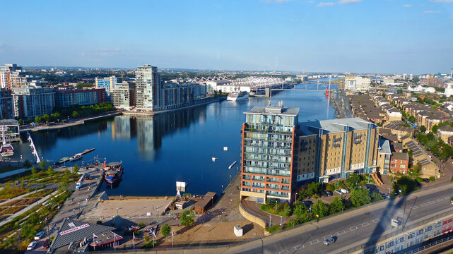 London, Great Britain &ndash; June 21, 2014. Aerial View of the modern waterfront district of Royal Docks and ExCeL Centre in London, England. vessels, street traffic and people.