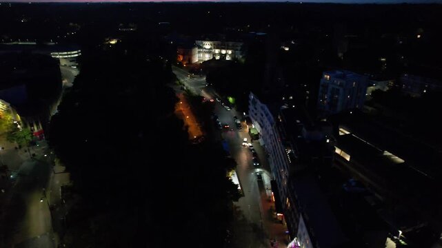 High Angle Night Footage of Illuminated Buildings and Roads with Traffic at Best Tourist Attraction Destination of England at Bournemouth City with Sandy Beach and Ocean of Great Britain, 