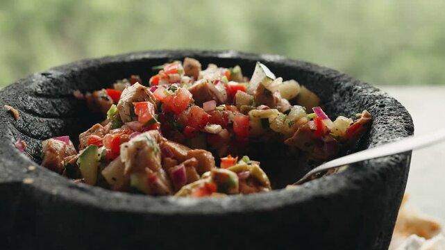 Close up of authentic peruvian ceviche made with fresh fish, tomato, onion, and avocado