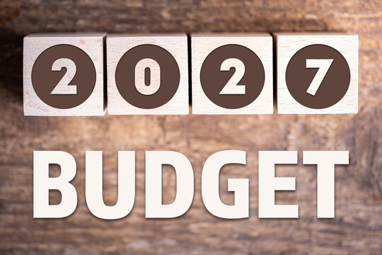 Budget 2027 new year on wooden blocks and office business concept background. 2027 Budget planning and allocation concept concept. 2027 New year resolutions, goals