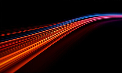 High-speed light trails rush forward through a dark environment, producing a strong sense of depth and perspective. Bright neon colors add energy to this futuristic abstract scene. © Keoftstock