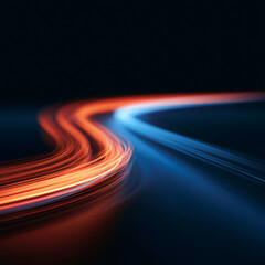 Dynamic orange and blue light trails curve across a dark background, creating a futuristic sense of speed, motion and energy. Ideal for technology and racing concepts. © Keoftstock