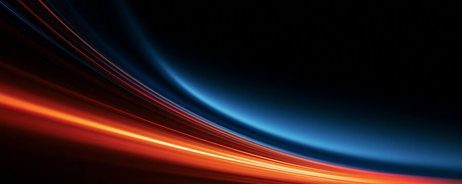 Vibrant light trails create a futuristic highway effect against a black background. Curved orange and blue lines convey rapid movement, acceleration, technology and dynamic energy.
