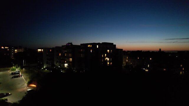 High Angle Night Footage of Illuminated Buildings and Roads with Traffic at Best Tourist Attraction Destination of England at Bournemouth City with Sandy Beach and Ocean of Great Britain, 