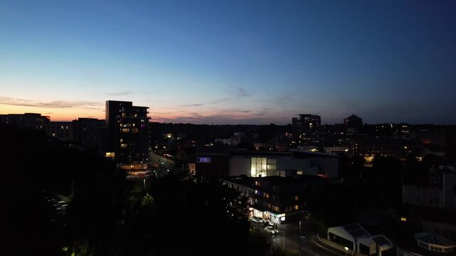 High Angle Night Footage of Illuminated Buildings and Roads with Traffic at Best Tourist Attraction Destination of England at Bournemouth City with Sandy Beach and Ocean of Great Britain, 