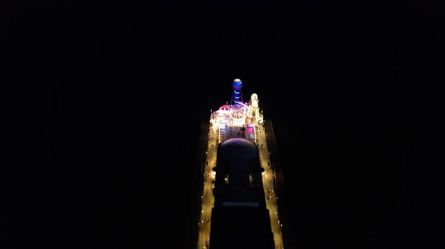 High Angle Night Footage of Illuminated Buildings and Roads with Traffic at Best Tourist Attraction Destination of England at Bournemouth City with Sandy Beach and Ocean of Great Britain, 