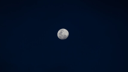 full moon over blue sky © Camilo Peláez