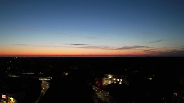 High Angle Night Footage of Illuminated Buildings and Roads with Traffic at Best Tourist Attraction Destination of England at Bournemouth City with Sandy Beach and Ocean of Great Britain, 