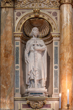 Marble statue of Saint Emeric holding a sword and lily in a niche inside Saint Stephen's Basilica in Budapest