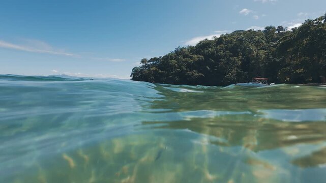 Underwater view of the sea and sandy beach near the island of Ilha Grande in Brazil