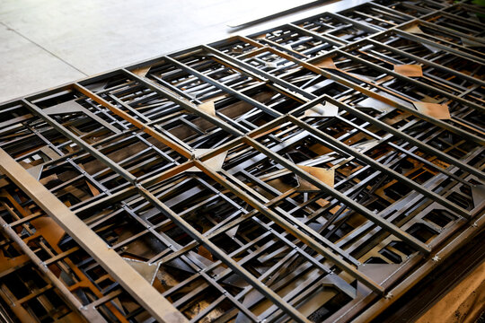 Stacked steel frames and metal structures in a fabrication workshop