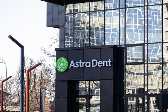 Kyiv, Ukraine - March 15, 2026: Astra Dent signage mounted on the modern glass facade of a professional dental clinic building, representing healthcare and high-quality oral care