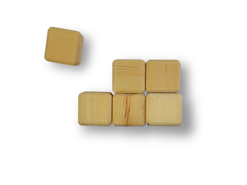 Wooden toy blocks stack with one falling cube isolated on transparent background