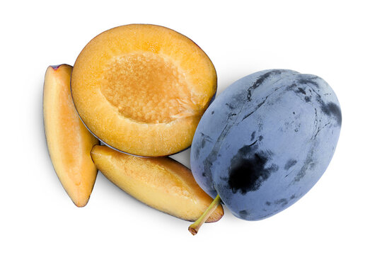 fresh blue plum with slices isolated on white background. Top view. Flat lay