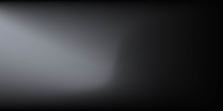 Sandblasted or brushed titanium or steel metal surface, the light reflection of the curved lines creates a smooth gradation on the dark black metallic background