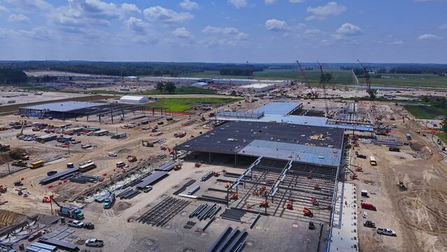 Saline, Michigan, United States - 07 August 2026: Aerial view of the Oracle data center construction site featuring large steel structures, heavy machinery, and ongoing development work.
