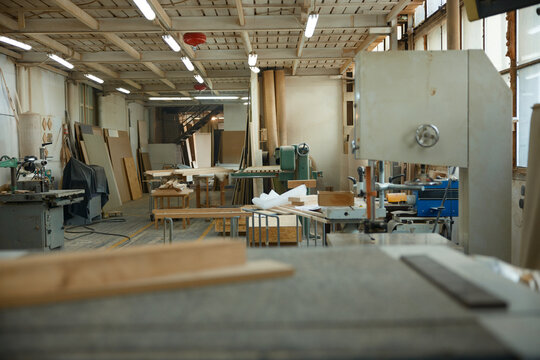 Abandoned carpentry space with equipment. Laboratory of woodcraft with manufacturing apparatus