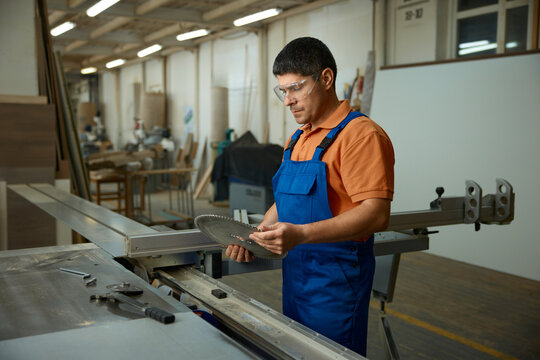 Operator systematically prepares machine for high-precision cutting task implementation