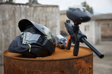 Fototapeta premium Military weapon and a helmet are placed on the barrel at the training field