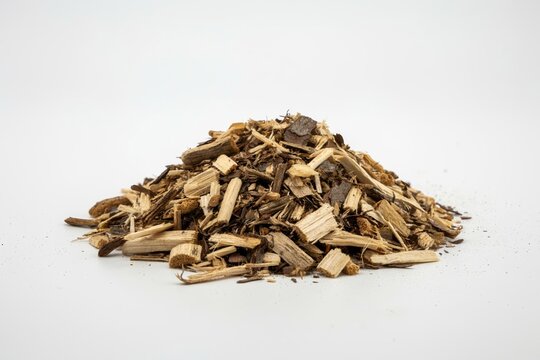 A pile of wood chips and bark mulch isolated on white background