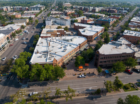 Fort Collins, United States - 06 August 2026: Aerial view of the historic Old Town district with its distinctive triangular building blocks, tree-lined streets, and urban architecture.