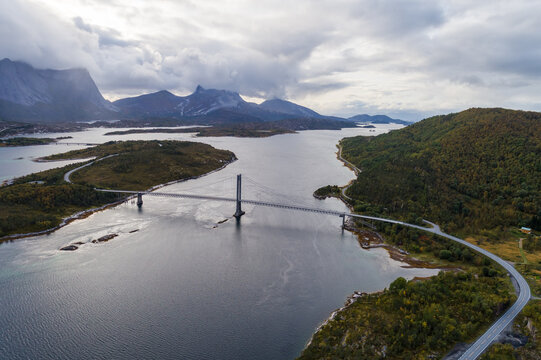 Efjord Bridge and winding roads beneath mountain clouds